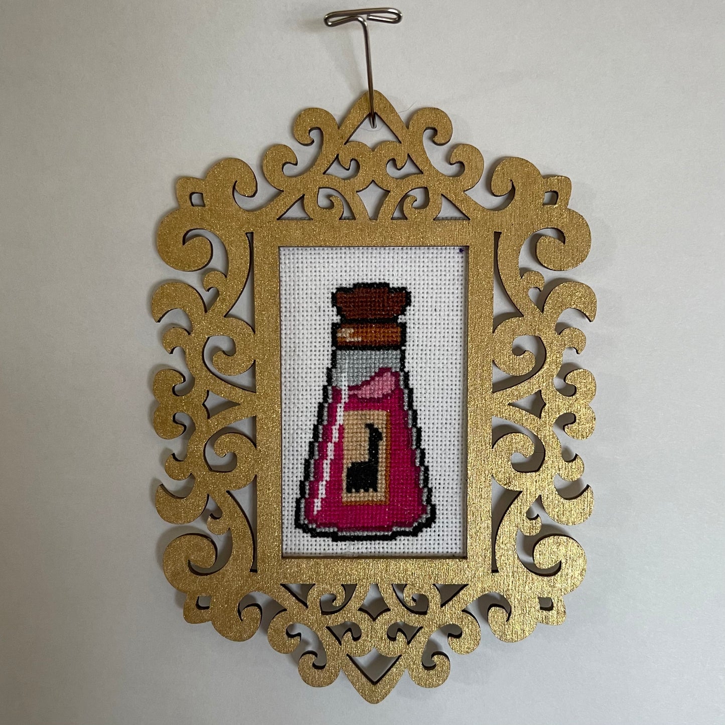 Kuzco's Poison - Framed Cross Stitch