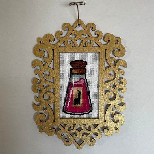 Kuzco's Poison - Framed Cross Stitch